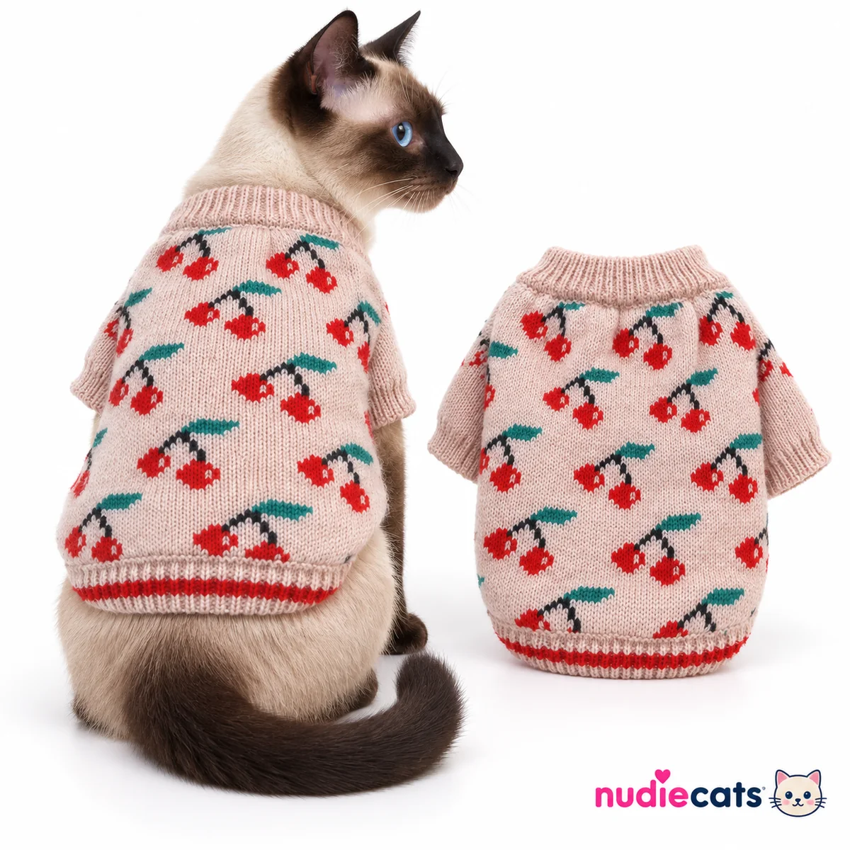 Siamese cat wearing blush pink cherry knit cat sweater