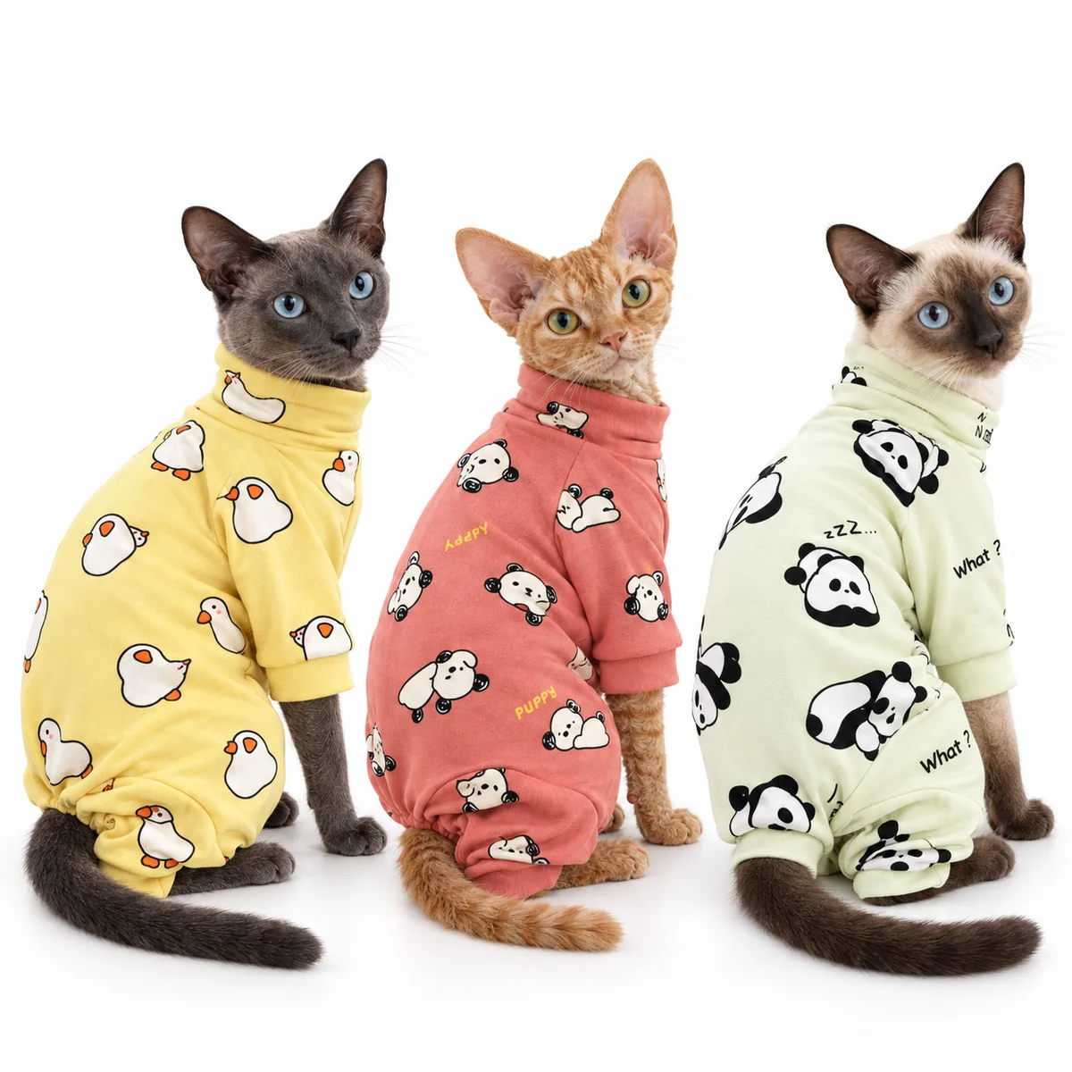 Three cats wearing Ducky Sunshine, Puppy Cuddles and Sleepy Panda cotton pyjamas on a clean white background