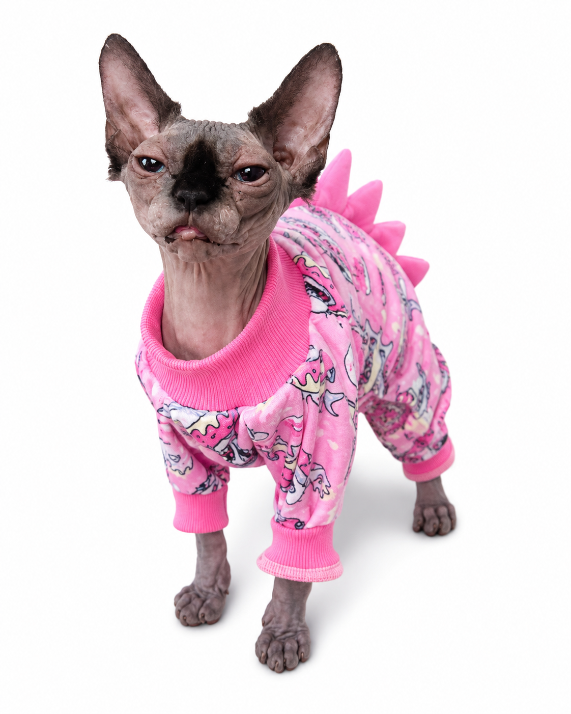 Sphynx cat wearing the pink Super Soft Dinosaur Onesie by NudieCats